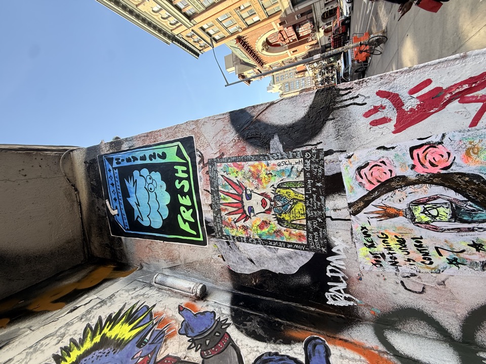 Street art stickers and black wall corner